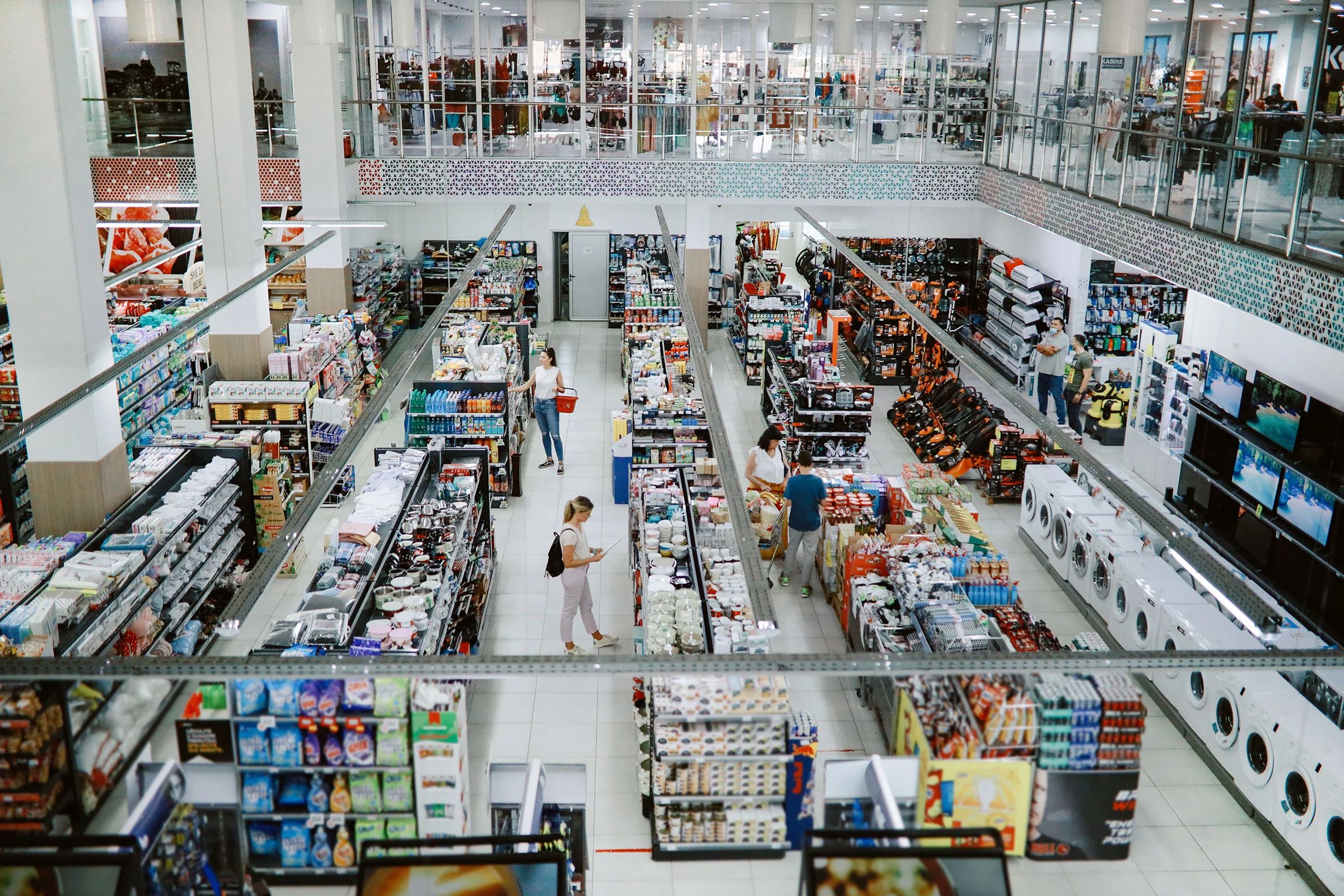 Overhead view of many people shopping in a large supermarket