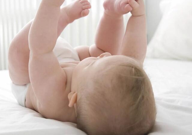Baby laying on its back