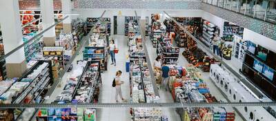 Overhead view of many people shopping in a large supermarket